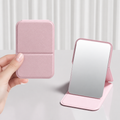 Pink foldable pocket mirror shown closed and open