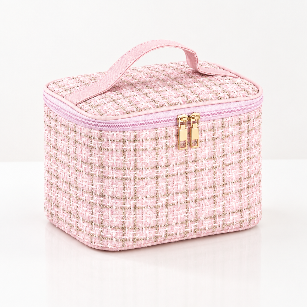 Pink knitted plaid handheld makeup bag with gold zipper hardware on clean white background